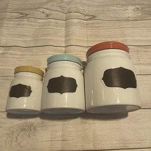 A set of three Farmhouse style Kitchen Canisters. Threshold Design